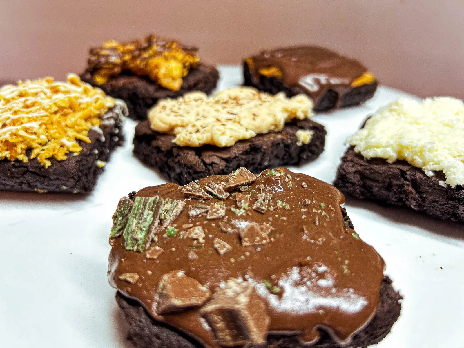 Peppermint Crisp brownie close up, with mint caramel and chocolate shards